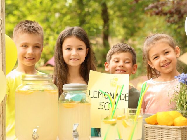 Children work together at lemonade stand 978b8d064138018a1dfad71b9882dd21