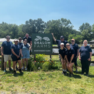 Chris Shockley worked alongside employees and members at a volunteer event at Shalom Farms.